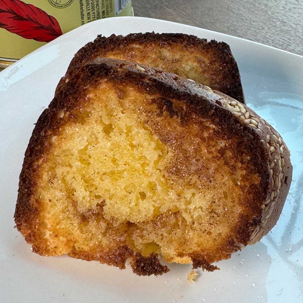 A slice of batter bread well toasted with Red Feather butter and cinnamon sugar.