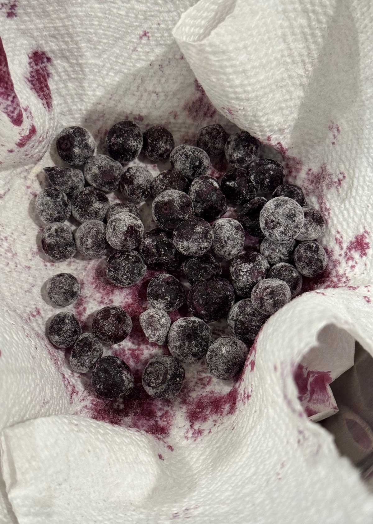 Blueberries that have been drained and tossed with flour.