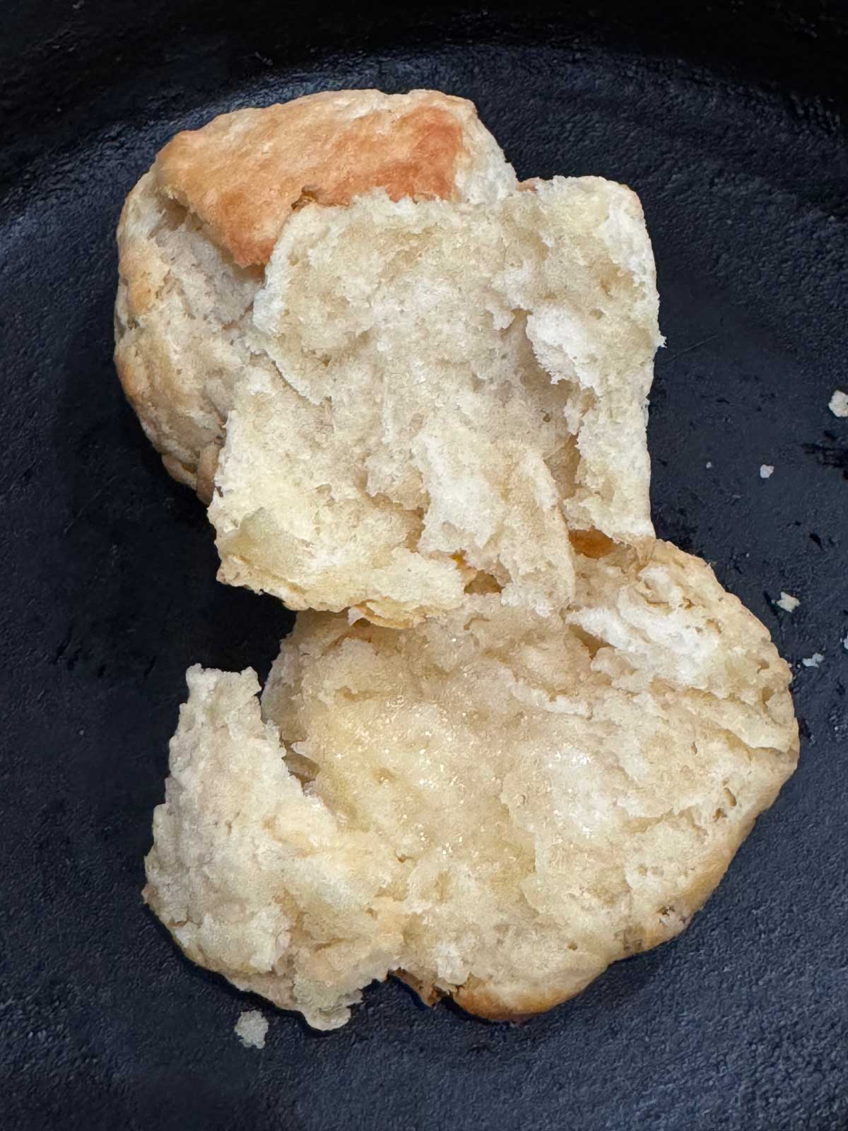 Biscuit split to show moist and buttery texture.