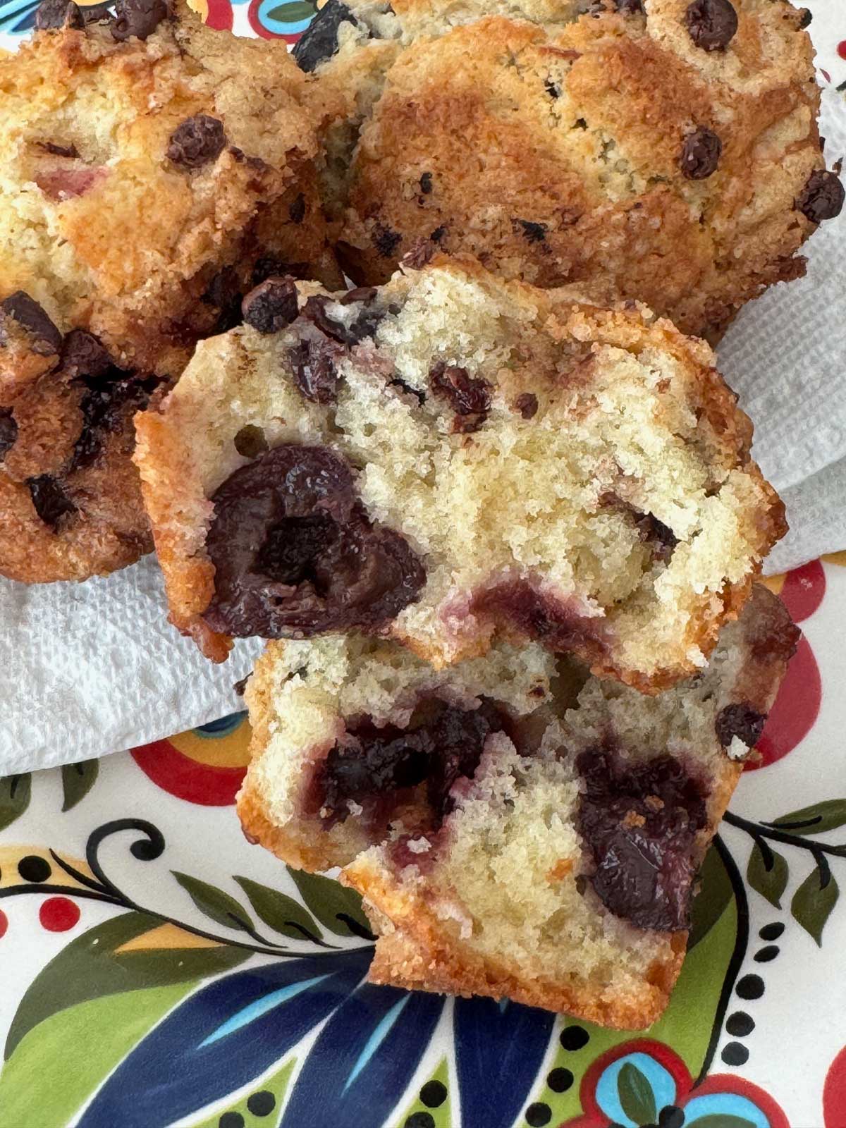 A moist chocolate cherry muffin made with creme fraiche. This muffin is split to show texture.