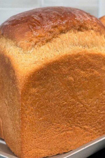 A cube shaped loaf of sourdough discard bread made without eggs.