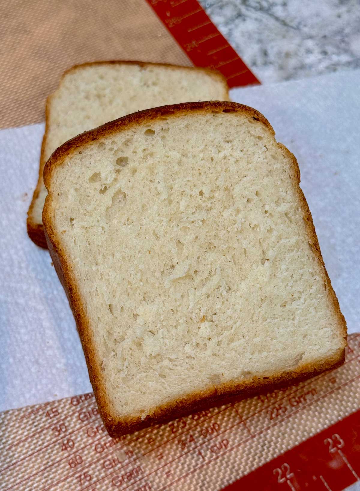 Slices of homemade sandwich bread made with sourdough discard.