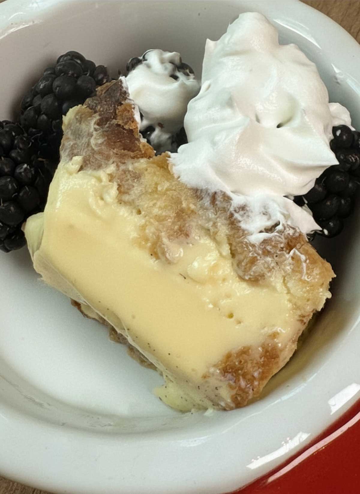 Small Batch Croissant Bread Pudding recipe sliced to show smooth and creamy custard texture.
