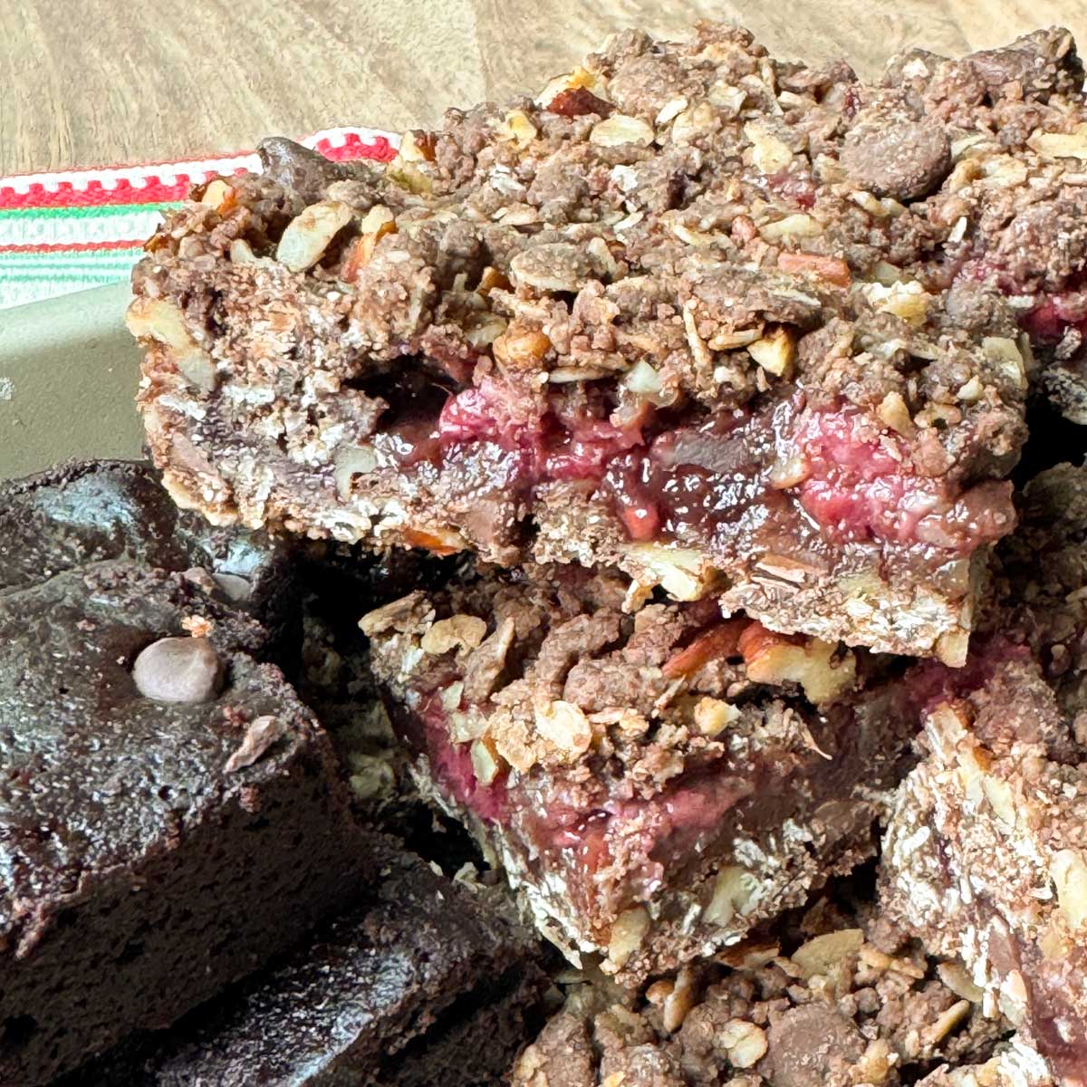 Chocolate Oatmeal Raspberry Bars recipe with fresh raspberries and preserves in the filling.