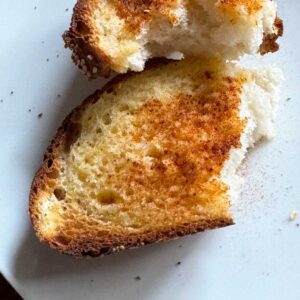 Fluffy Italian bread recipe with sourdough discard made as garlic toast.