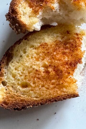 Fluffy Italian bread recipe with sourdough discard made as garlic toast.