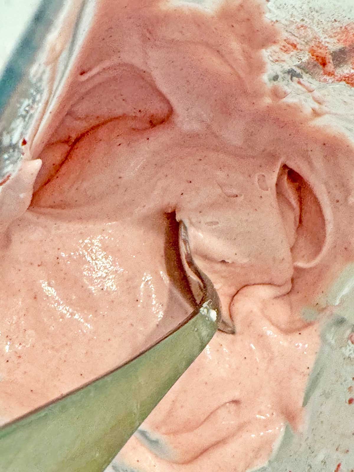 Smooth and creamy homemade strawberry ice cream recipe base in the blender.