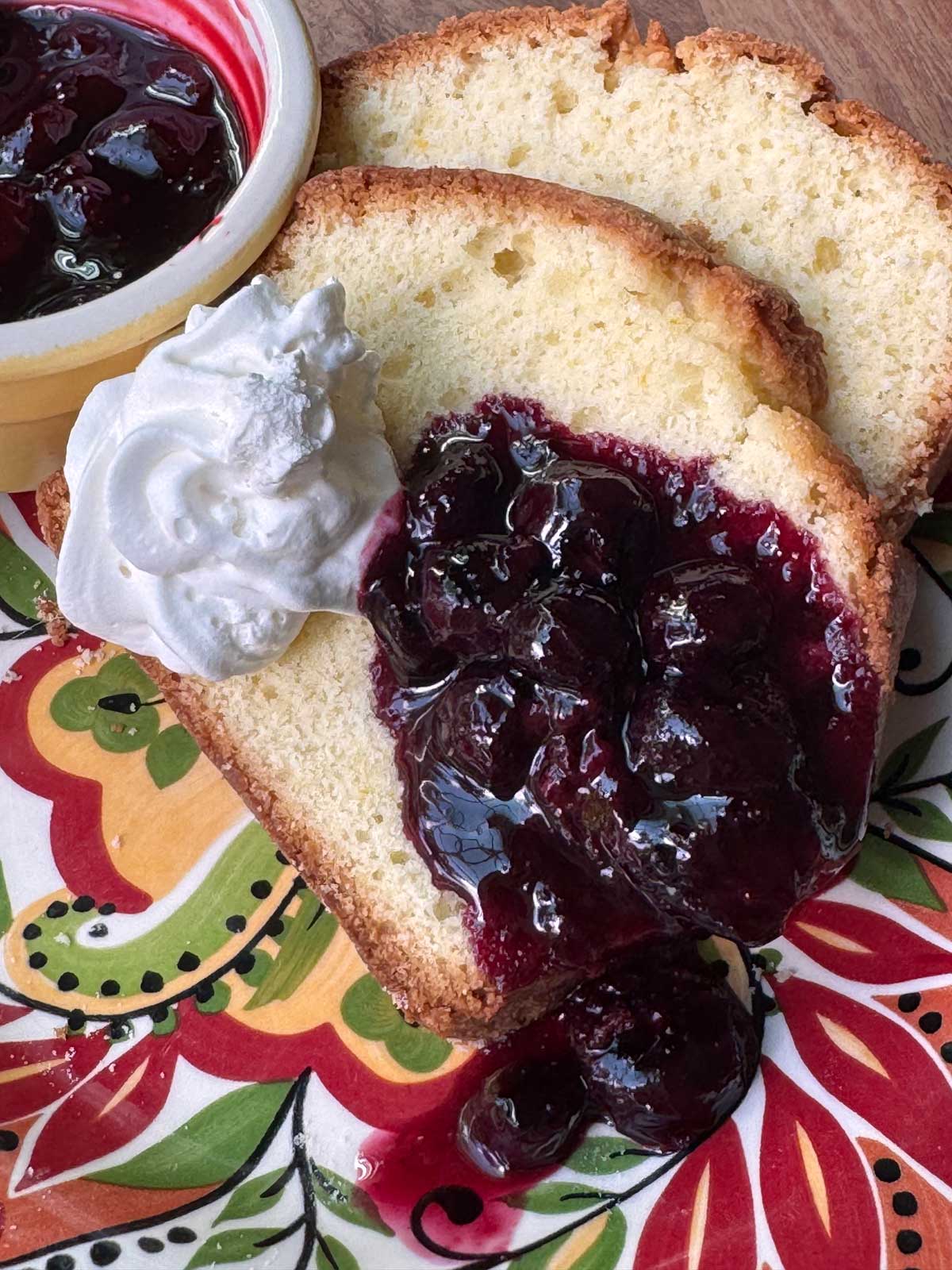 Recipe for Orange Loaf Cake with basic blueberry sauce flavored with Grand Marnier.