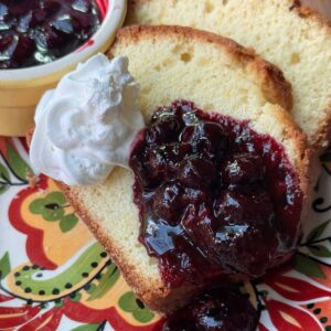 Recipe for Orange Loaf Cake with basic blueberry sauce flavored with Grand Marnier.