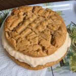 An ice cream sandwich cookie made with two America's Test Kitchen chewy peanut butter cookies and peanut butter ice cream.